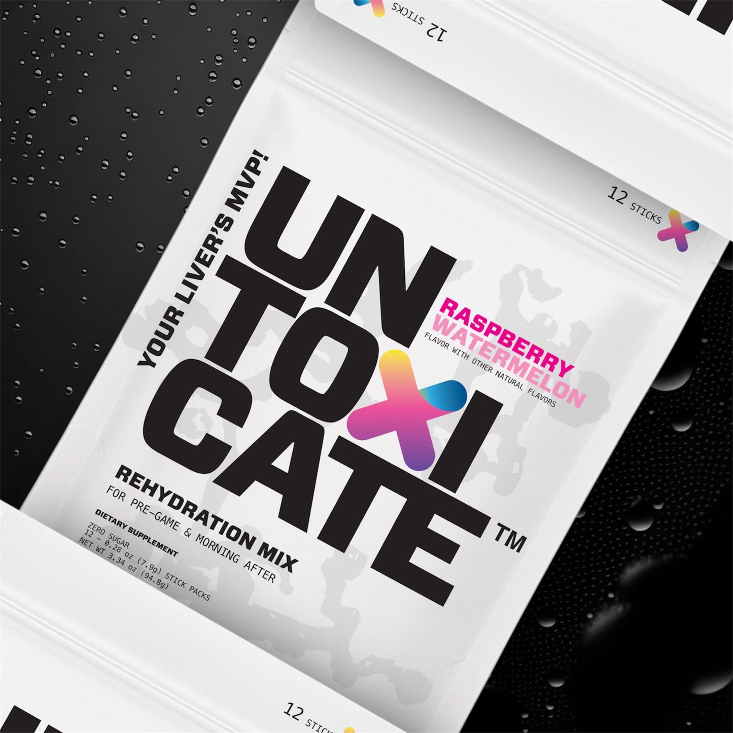Untoxicate rehydration mix package on a black textured background
