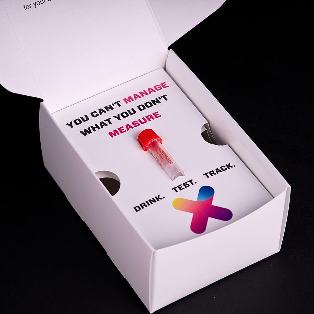 Inside the Untoxicate liver function test kit showing sample collection vial and test materials